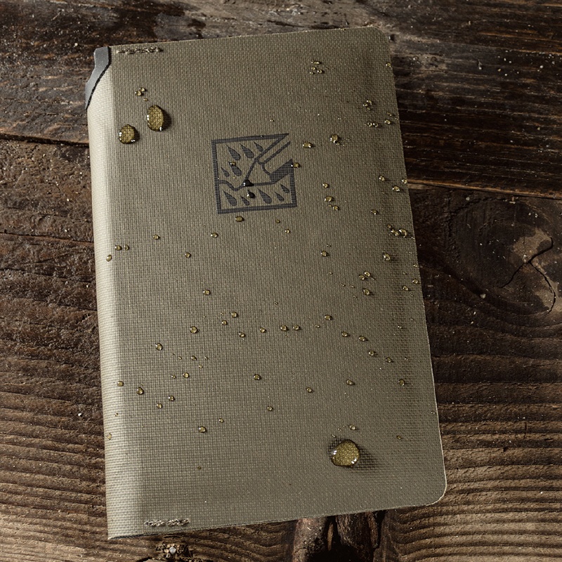 Closed wallet sitting on wood background.